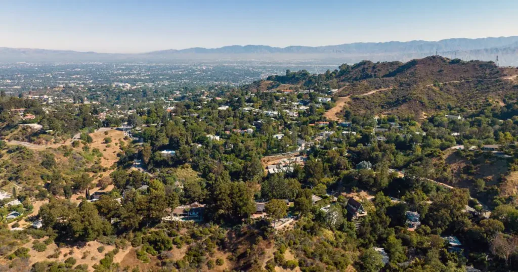Aerial view of hillside residential area in Los Angeles showing terrain and site conditions