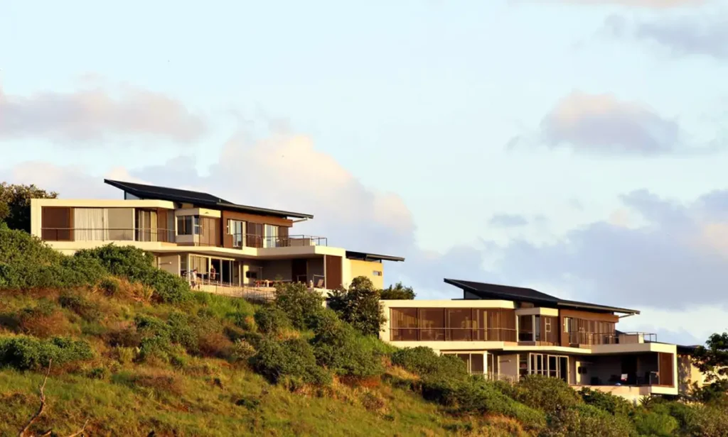 Modern hillside homes with contemporary architecture and sloped terrain