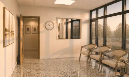 Modern medical office waiting room with natural light and seating area