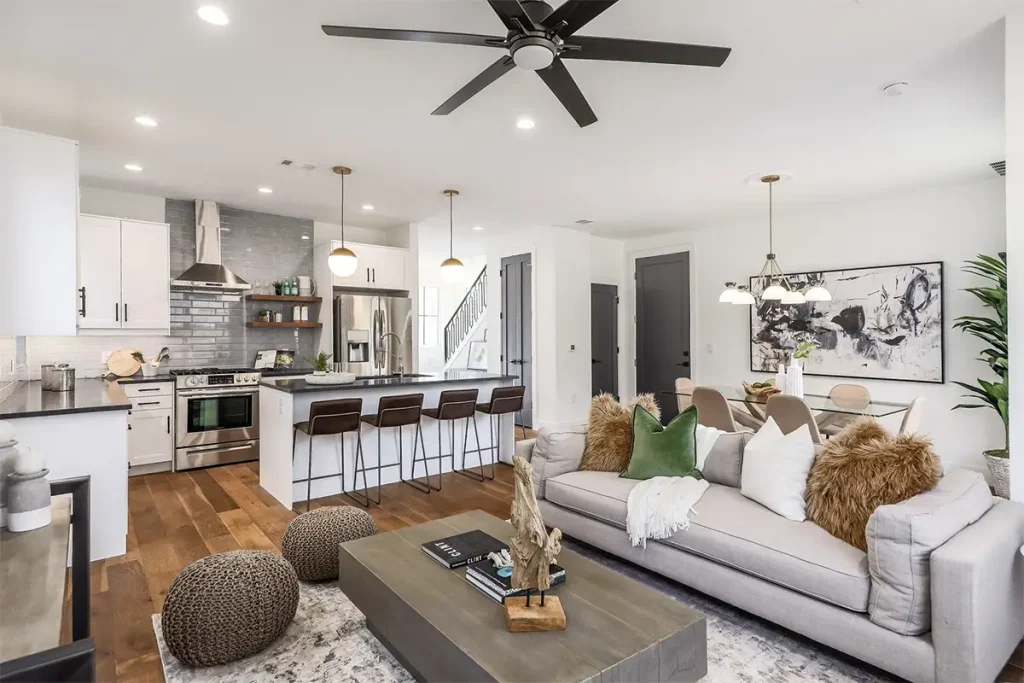 Modern open-concept kitchen connected to a spacious living room